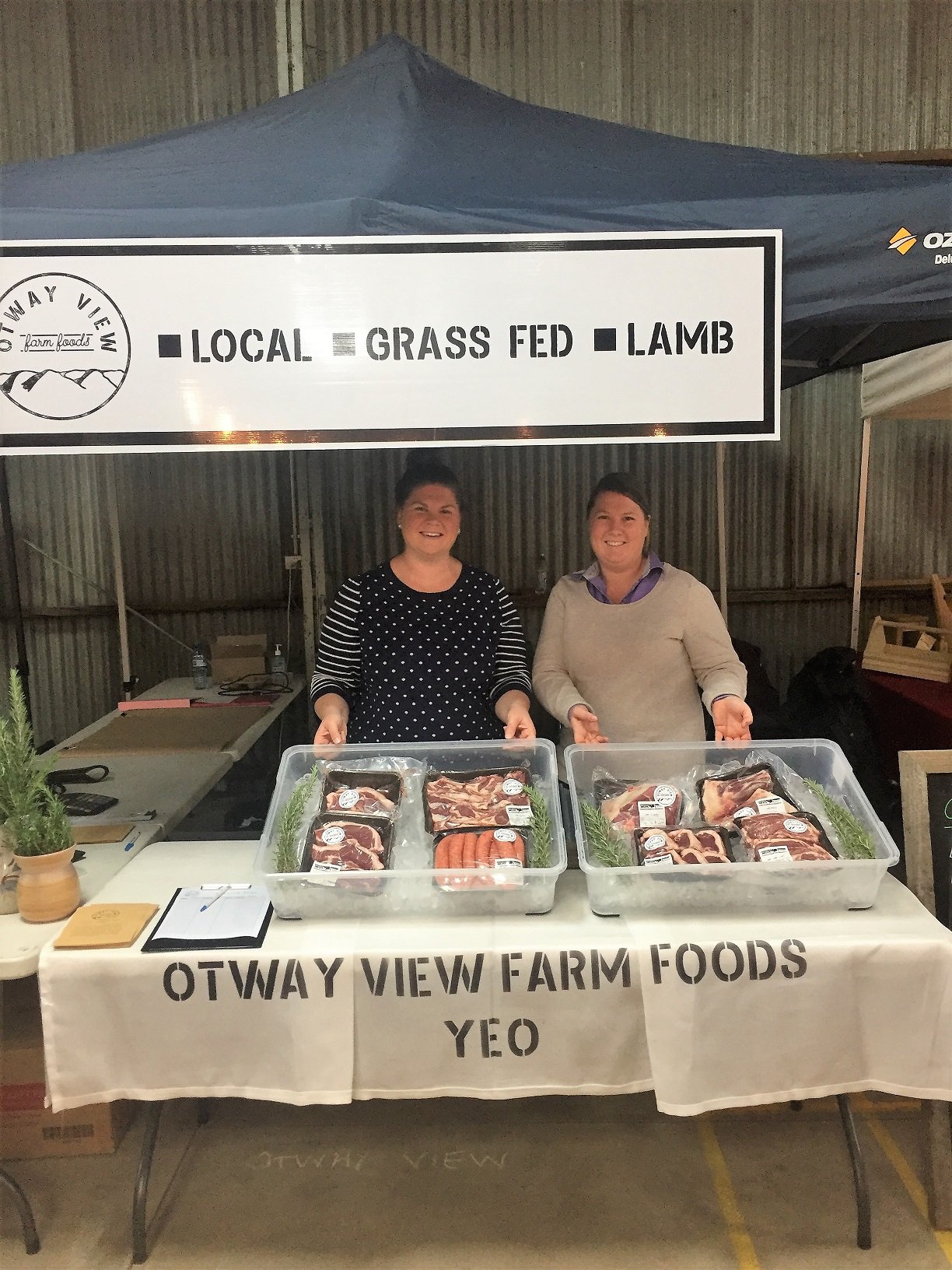 Pic of The Potters selling their produce at a farmers' market