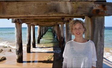 2017 Victorian AgriFutures Rural Women's Award winner Kirsten Abernethy on beach under jetty