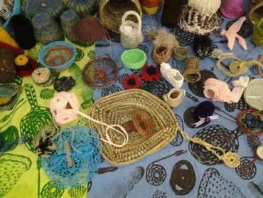 Colourful baskets woven from natural materials by Indigenous women