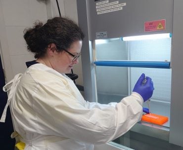 Emily Scholes, Founder of EnviroMicroBio, works in the laboratory