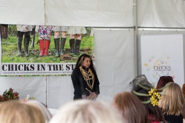Dja Dja Wurrung woman Rebecca Phillips stands in front of audience at Chicks in the Sticks event