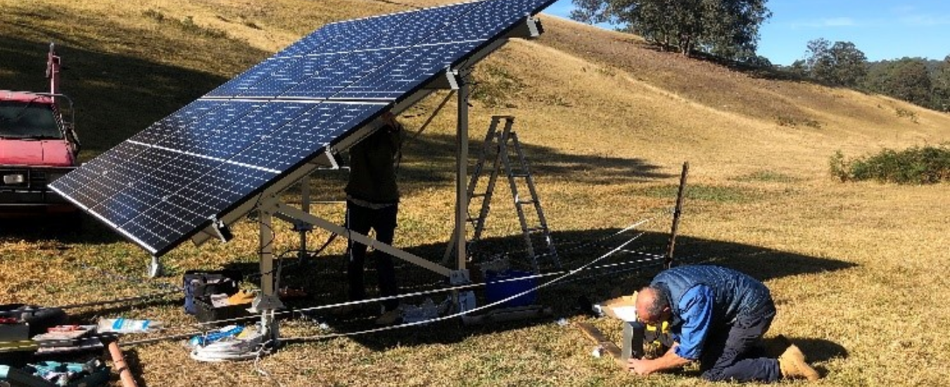 Solar panel used for pumping with man working on it
