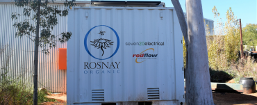 Flow battery storage outdoors on Rosnay Winery Canowindra amongst gum trees and farm shed NSW